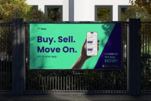 Large billboard promoting Yelsa app with text 'Buy. Sell. Move On.' and smartphone graphic on a green background